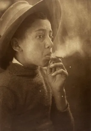 Untitled [Boy smoking wearing a wide-brimmed hat]