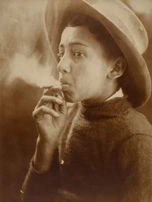 Untitled [Boy smoking wearing a wide-brimmed hat]
