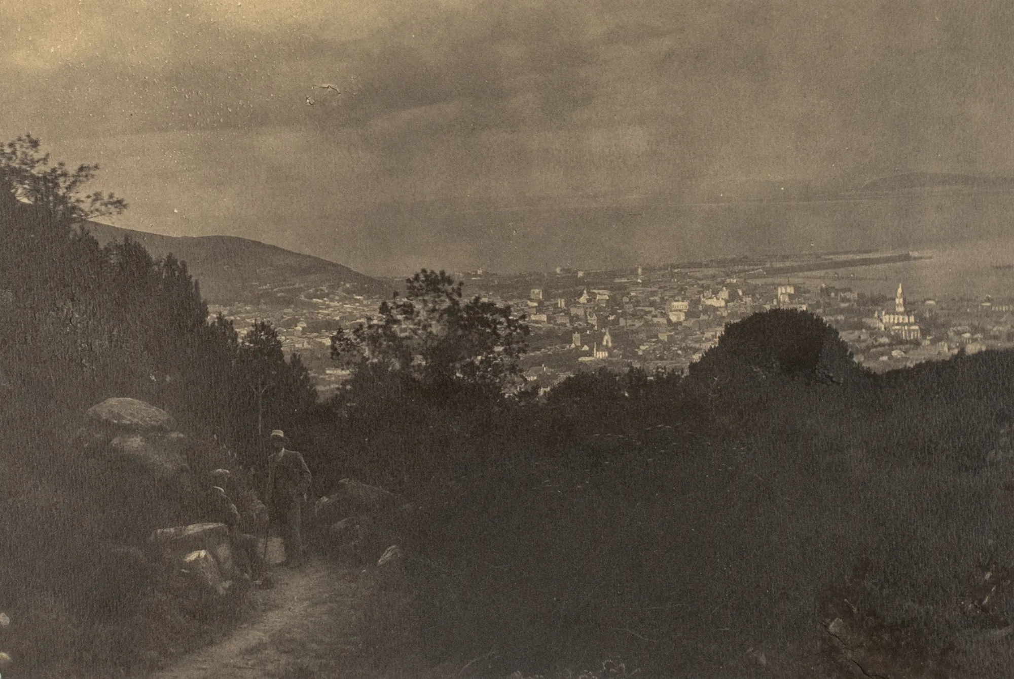 Untitled [Two men on a vista overlooking Cape Town]
