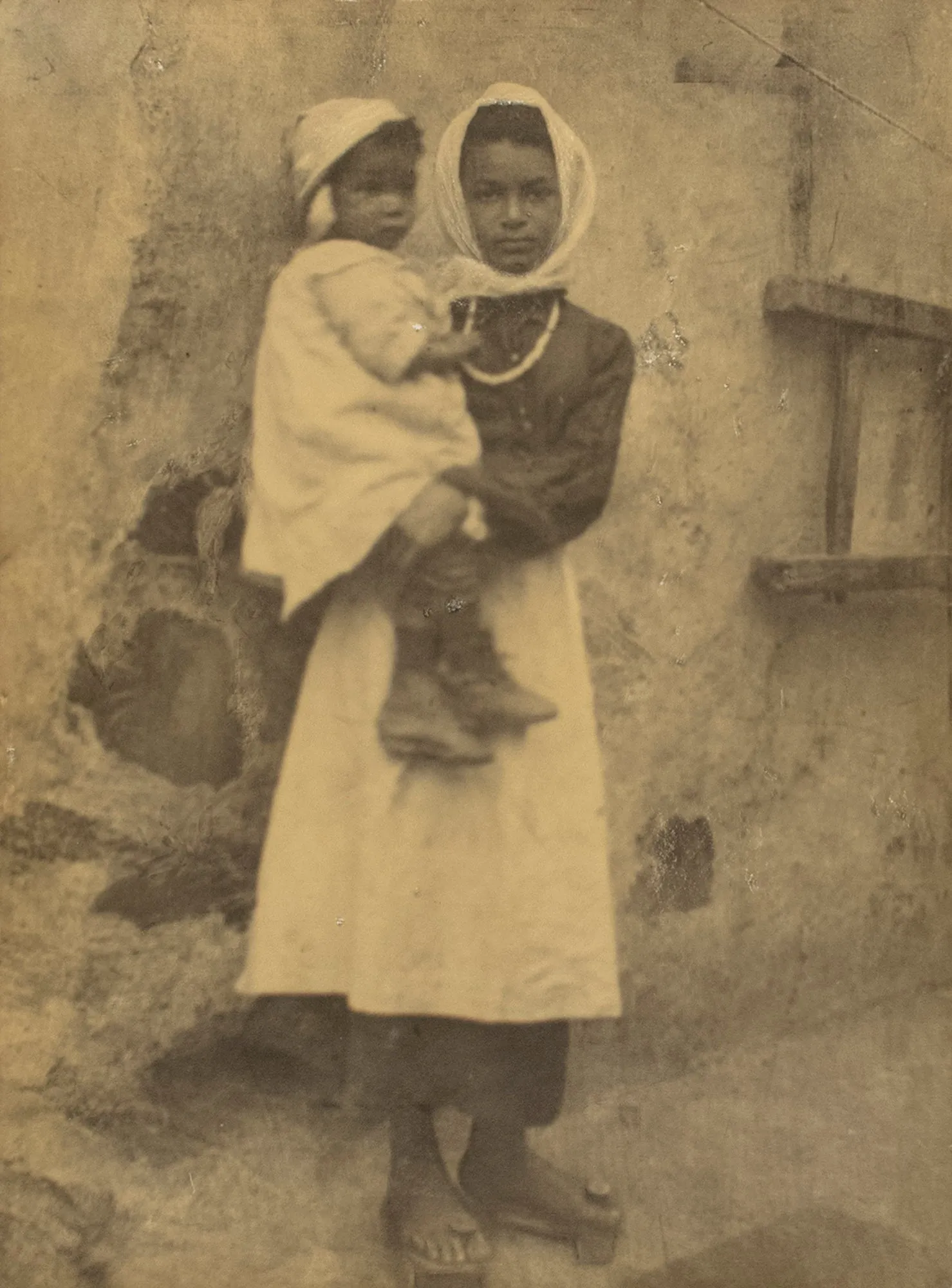 Untitled [Woman holding child]