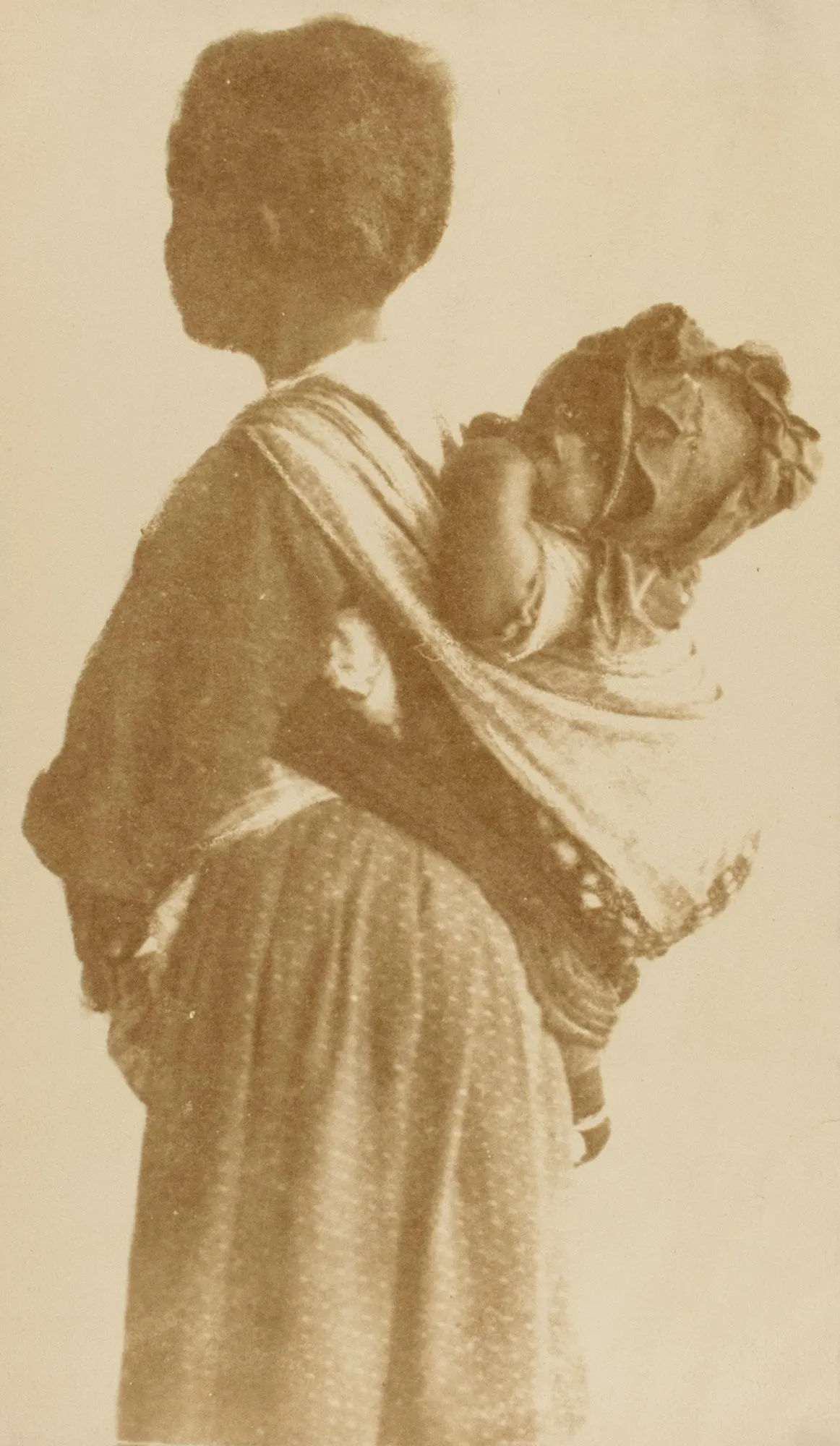 Untitled [Woman with baby in a sling]