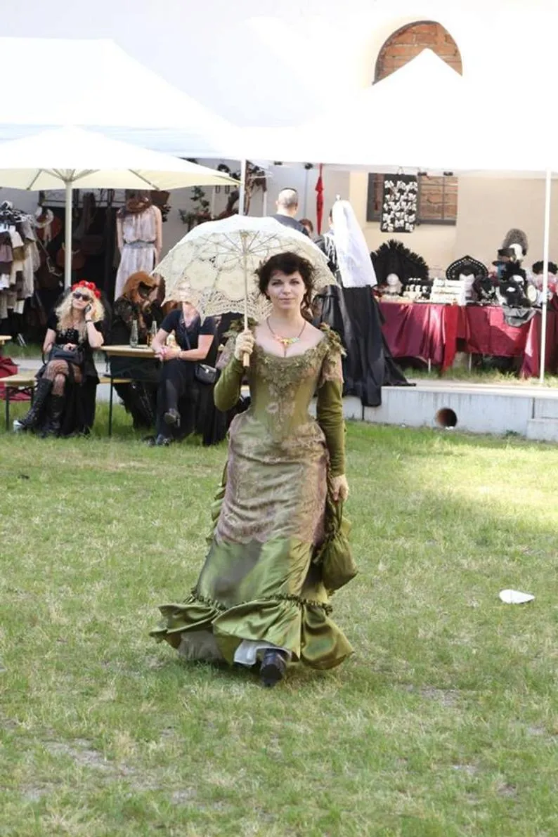 Victorian green walking silk costume with laces and metal spiders