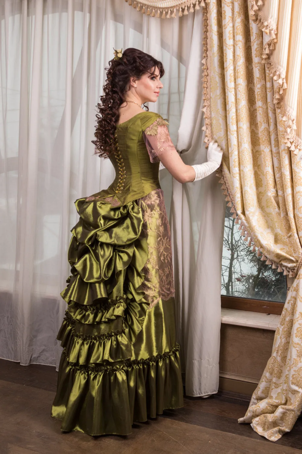 Victorian green walking silk costume with laces and metal spiders