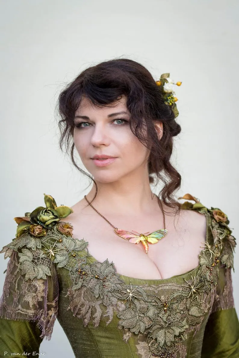 Victorian green walking silk costume with laces and metal spiders